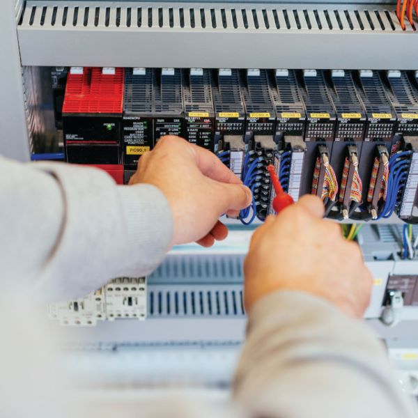 Engineer checking the fuses and power supply Industrial Electrical Integration