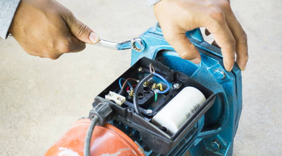 Electric,Motor,And,Man,Working,Equipment,Repair,On,Cement,Floor Control System Integration