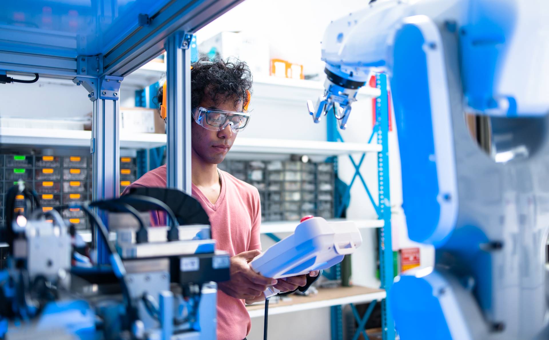 Asian Engineers Maintenance Robot Arm at Lab. they are in a High Factory Automation Integration